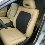Car seat with a black massage pillow on beige leather seats